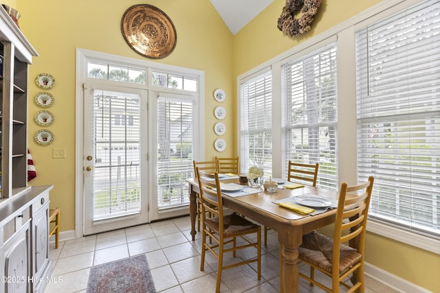 1178 Eastwood Landing Way, Sunset Beach, NC 28468 - dining space with plenty of natural light, vaulted ceiling, and light tile patterned flooring