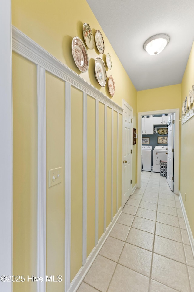 1178 Eastwood Landing Way, Sunset Beach, NC 28468 - corridor featuring separate washer and dryer and tile patterned flooring