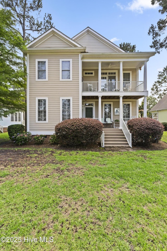1178 Eastwood Landing Way, Sunset Beach, NC 28468 - view of front of property featuring covered porch, a front yard, and a balcony