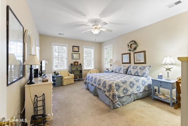 1178 Eastwood Landing Way, Sunset Beach, NC 28468 - carpeted bedroom with multiple windows and ceiling fan