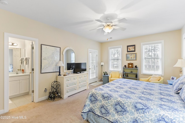 1178 Eastwood Landing Way, Sunset Beach, NC 28468 - bedroom featuring light carpet, connected bathroom, and ceiling fan