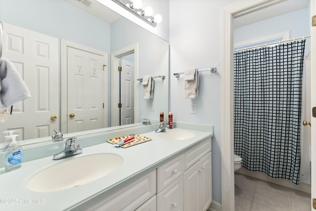 1178 Eastwood Landing Way, Sunset Beach, NC 28468 - bathroom with double vanity, tile patterned floors, and curtained shower