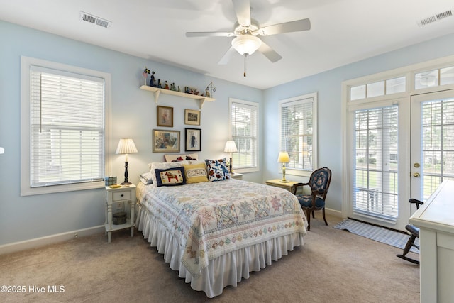 1178 Eastwood Landing Way, Sunset Beach, NC 28468 - carpeted bedroom featuring access to outside, multiple windows, ceiling fan, and french doors