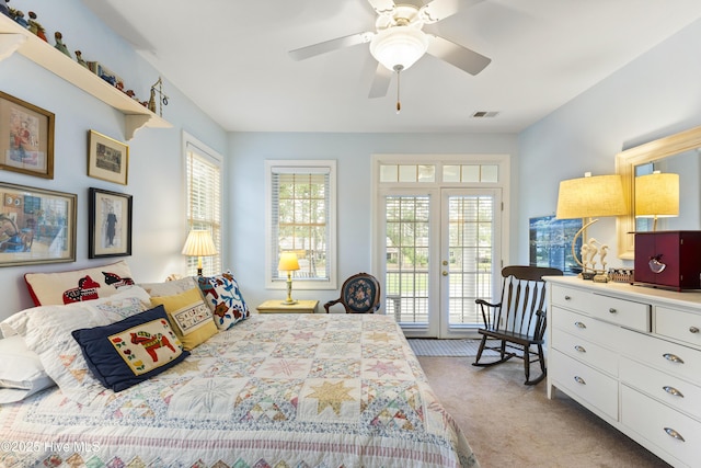 1178 Eastwood Landing Way, Sunset Beach, NC 28468 - bedroom with access to exterior, light carpet, multiple windows, and french doors
