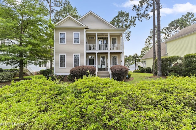1178 Eastwood Landing Way, Sunset Beach, NC 28468 - neoclassical / greek revival house featuring a balcony and a porch