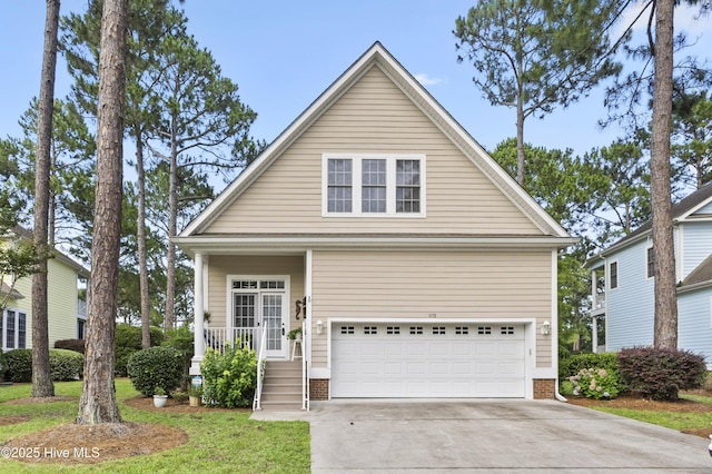 1178 Eastwood Landing Way, Sunset Beach, NC 28468 - view of front of property with an attached garage, driveway, brick siding, and a porch