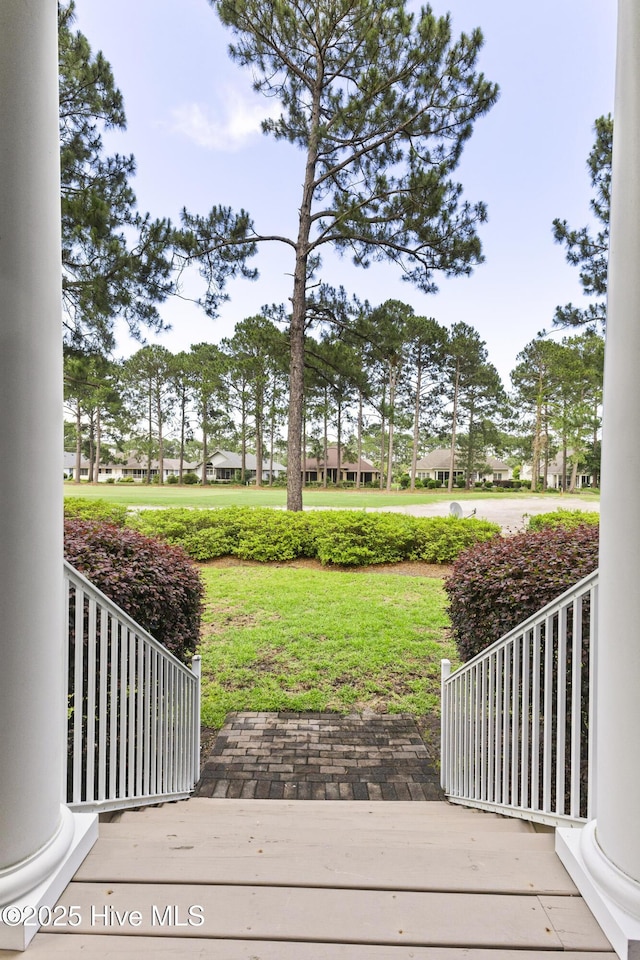 1178 Eastwood Landing Way, Sunset Beach, NC 28468 - wooden terrace featuring a lawn