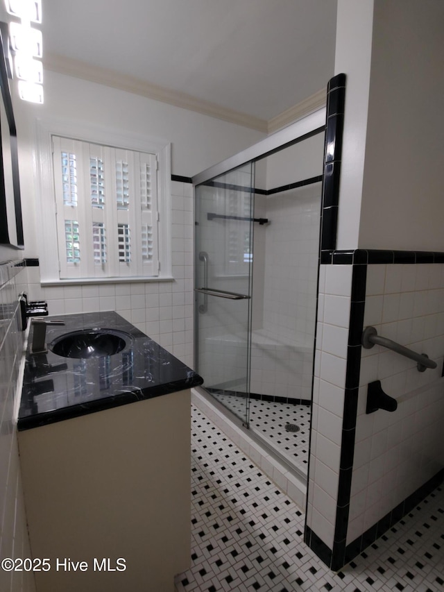1109 Treemont Rd NW, Wilson, NC 27896 - bathroom with tile walls, a shower stall, vanity, and crown molding