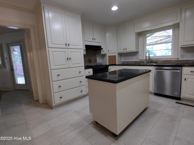 1109 Treemont Rd NW, Wilson, NC 27896 - kitchen featuring stainless steel dishwasher, white cabinetry, a kitchen island, dark countertops, and recessed lighting
