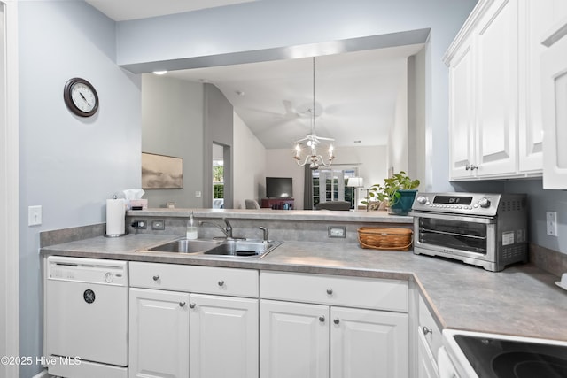 73 Field Planters Cir, Calabash, NC 28467 - kitchen featuring dishwasher, vaulted ceiling, white cabinetry, a chandelier, and light countertops