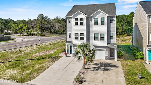 701 Elton Ave Unit 1, Carolina Beach, NC 28428 - view of front facade with driveway and an attached garage
