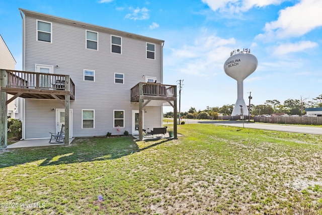 701 Elton Ave Unit 1, Carolina Beach, NC 28428 - rear view of property with a yard and a patio area