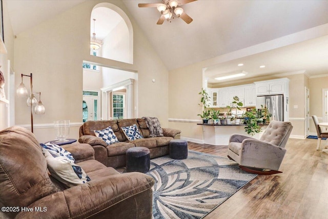 419 Morgan Trace Ln, Goldsboro, NC 27530 - living room with ceiling fan, light wood-style flooring, and high vaulted ceiling