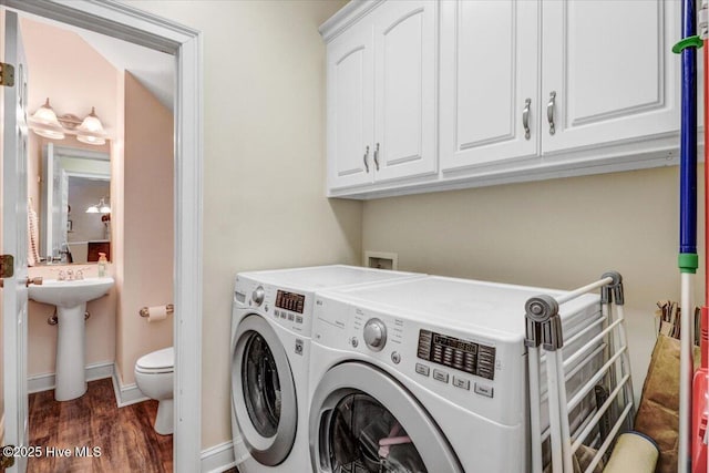 419 Morgan Trace Ln, Goldsboro, NC 27530 - laundry area featuring washing machine and dryer and wood finished floors