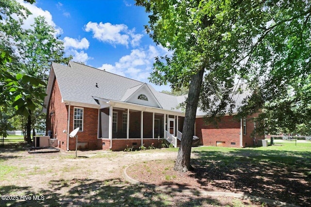 419 Morgan Trace Ln, Goldsboro, NC 27530 - rear view of house featuring crawl space, a sunroom, brick siding, and a shingled roof