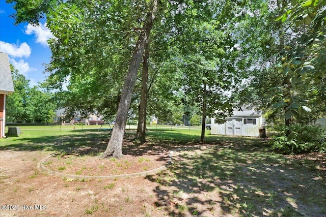 419 Morgan Trace Ln, Goldsboro, NC 27530 - view of green lawn featuring a storage unit