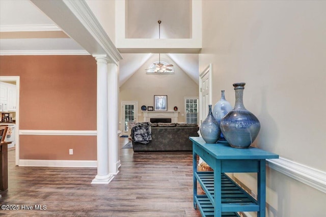 419 Morgan Trace Ln, Goldsboro, NC 27530 - foyer featuring ornate columns, wood finished floors, a fireplace, and ornamental molding