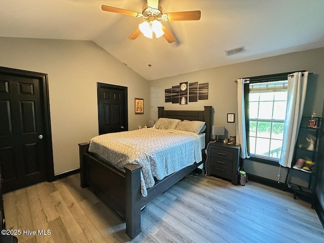 202 Oak Ridge Ln, Holly Ridge, NC 28445 - bedroom with light wood finished floors, lofted ceiling, and ceiling fan