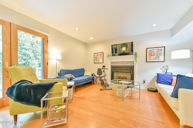 875 Martin Luther King Jr Blvd Apt 7, Chapel Hill, NC 27514 - living room with wood finished floors, a tile fireplace, and recessed lighting