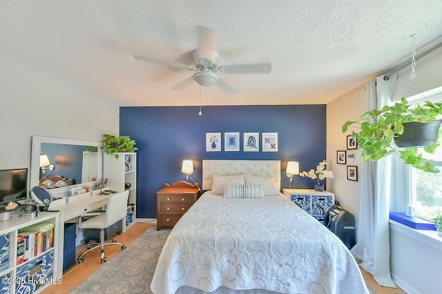 875 Martin Luther King Jr Blvd Apt 7, Chapel Hill, NC 27514 - bedroom featuring a desk, ceiling fan, a textured ceiling, and wood finished floors