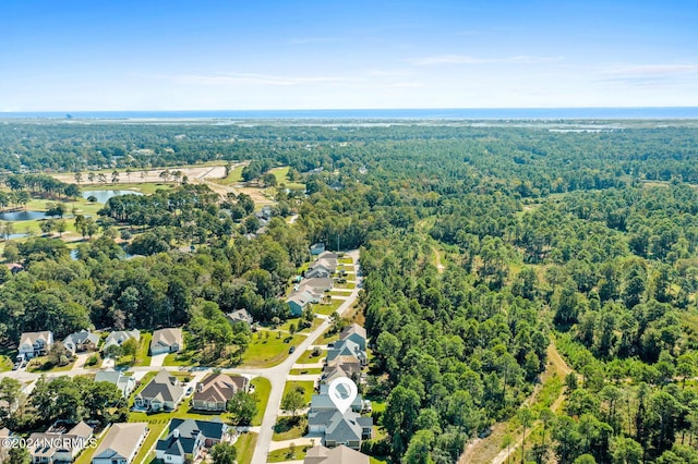1119 Sea Bourne Way, Sunset Beach, NC 28468 - aerial view of residential area featuring a nearby body of water and a heavily wooded area