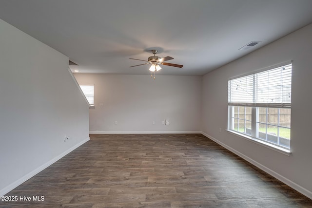 411 Isabelle St, New Bern, NC 28560 - unfurnished room featuring ceiling fan, plenty of natural light, and dark wood-style flooring