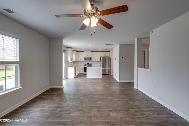 411 Isabelle St, New Bern, NC 28560 - unfurnished living room featuring dark wood-style flooring, ceiling fan, and recessed lighting
