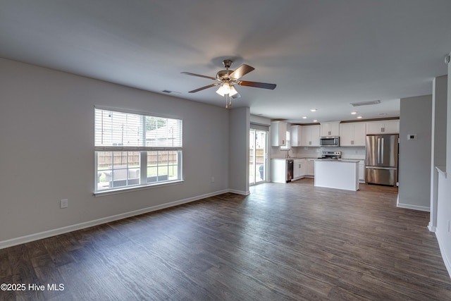 411 Isabelle St, New Bern, NC 28560 - unfurnished living room featuring ceiling fan, dark wood finished floors, and recessed lighting