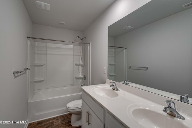 411 Isabelle St, New Bern, NC 28560 - bathroom featuring wood finished floors, double vanity, and shower / bath combination