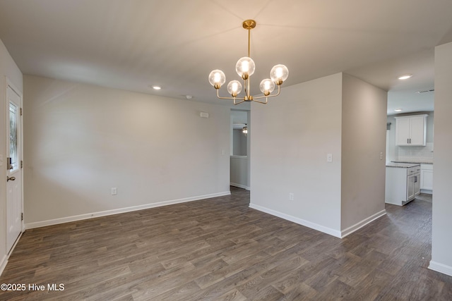 411 Isabelle St, New Bern, NC 28560 - unfurnished room featuring dark wood-type flooring, recessed lighting, and a chandelier