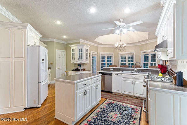 35 Magnolia Ave, Pinehurst, NC 28374 - kitchen with white refrigerator with ice dispenser, stainless steel dishwasher, range with gas stovetop, range hood, and a ceiling fan
