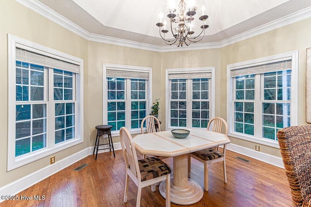 35 Magnolia Ave, Pinehurst, NC 28374 - dining room featuring a chandelier, wood finished floors, and ornamental molding