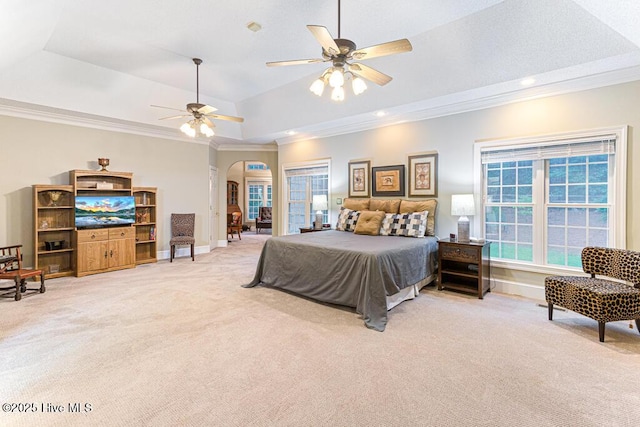 35 Magnolia Ave, Pinehurst, NC 28374 - bedroom with light colored carpet, arched walkways, ornamental molding, a tray ceiling, and ceiling fan