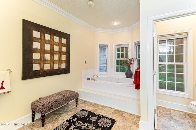 35 Magnolia Ave, Pinehurst, NC 28374 - bathroom featuring ornamental molding, a garden tub, and a textured ceiling