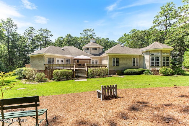 35 Magnolia Ave, Pinehurst, NC 28374 - rear view of house with a deck, a yard, and a gazebo