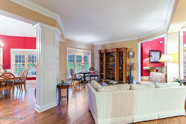 35 Magnolia Ave, Pinehurst, NC 28374 - living room with a textured ceiling, wood finished floors, ornate columns, and ornamental molding
