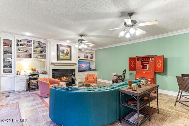 35 Magnolia Ave, Pinehurst, NC 28374 - living area featuring crown molding, ceiling fan, a premium fireplace, a textured ceiling, and built in features