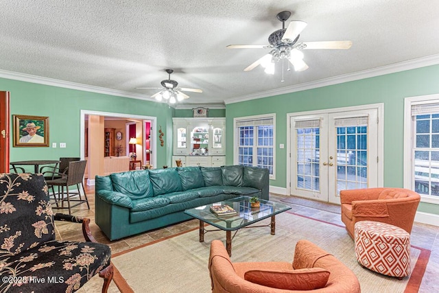 35 Magnolia Ave, Pinehurst, NC 28374 - living room with french doors, ornamental molding, ceiling fan, and a textured ceiling