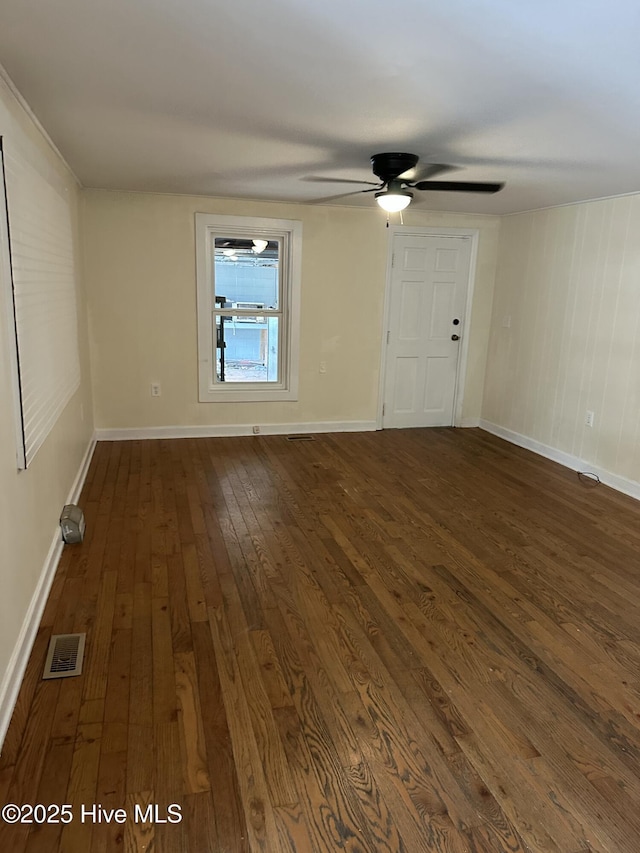 4735 Cedar Ln SW, Ocean Isle Beach, NC 28469 - spare room with dark wood-style floors and a ceiling fan