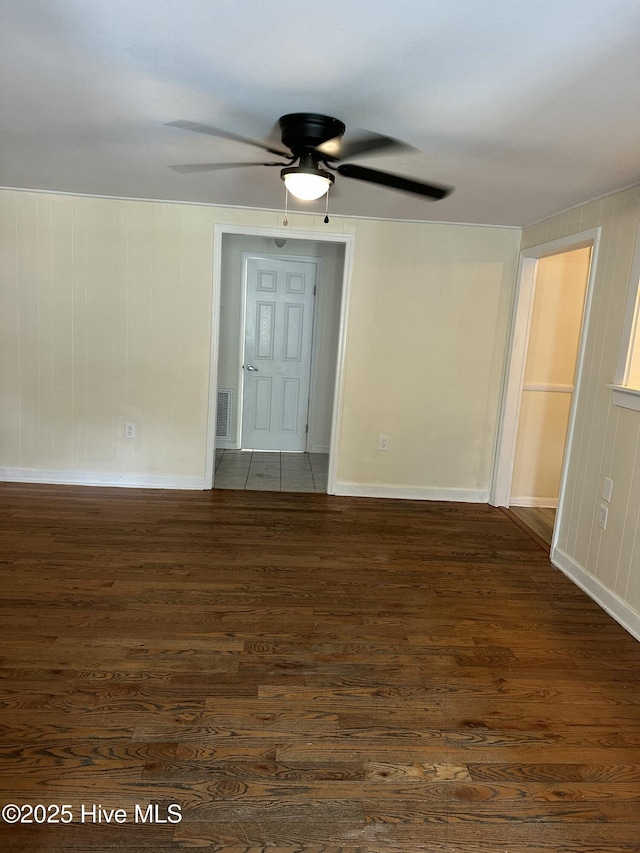 4735 Cedar Ln SW, Ocean Isle Beach, NC 28469 - empty room featuring dark wood-type flooring and ceiling fan