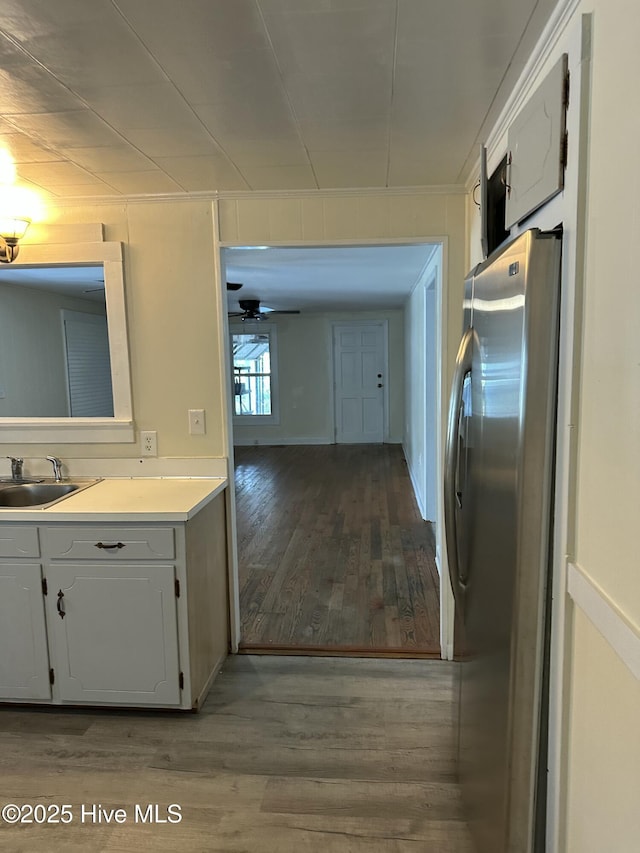 4735 Cedar Ln SW, Ocean Isle Beach, NC 28469 - kitchen featuring wood finished floors, light countertops, a ceiling fan, and freestanding refrigerator