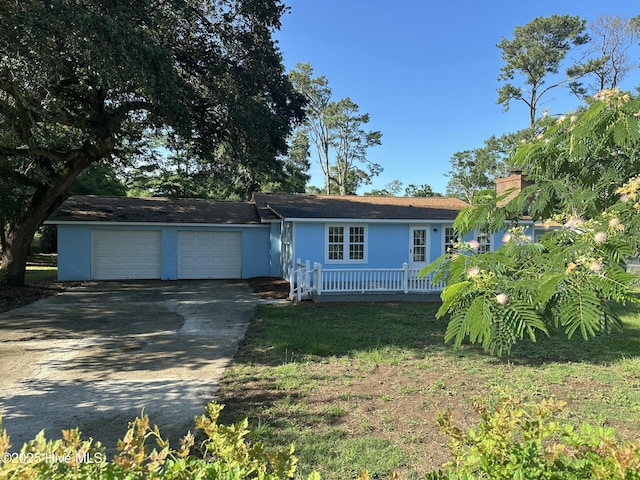 4735 Cedar Ln SW, Ocean Isle Beach, NC 28469 - ranch-style house with an attached garage, concrete driveway, and a chimney