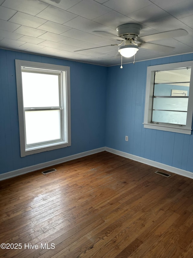 4735 Cedar Ln SW, Ocean Isle Beach, NC 28469 - empty room with a ceiling fan and dark wood finished floors