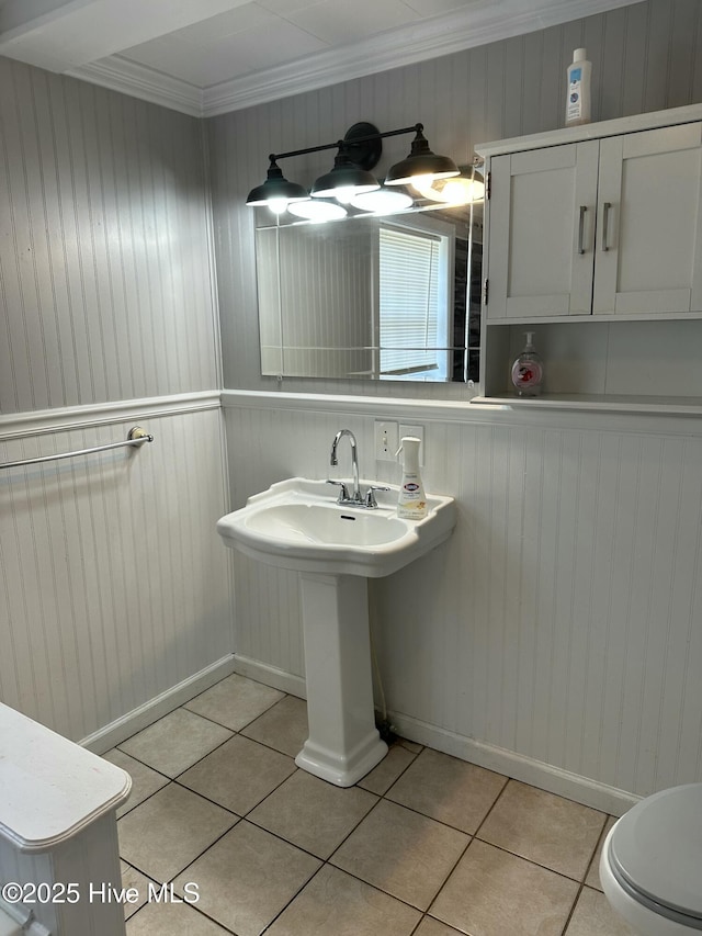 4735 Cedar Ln SW, Ocean Isle Beach, NC 28469 - half bath with tile patterned floors, ornamental molding, and wood walls