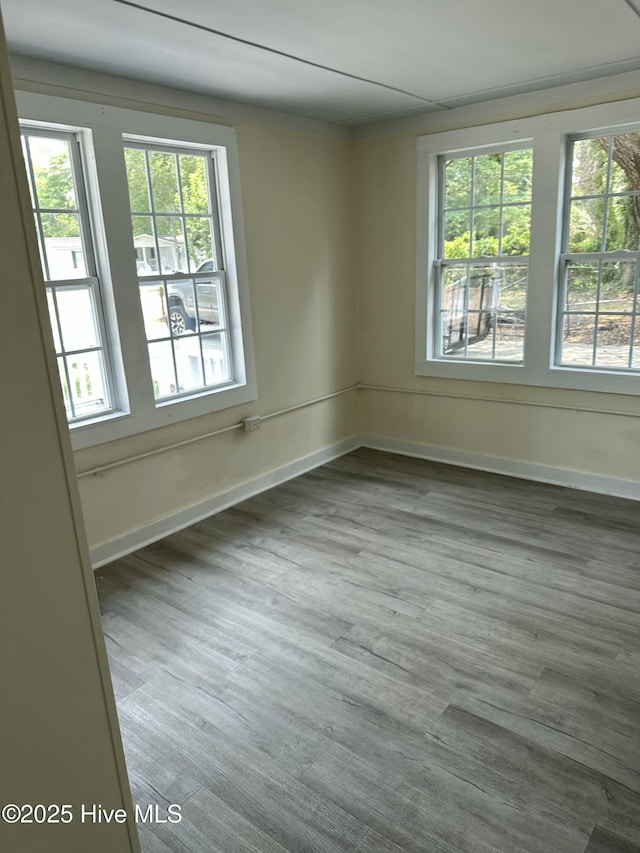 4735 Cedar Ln SW, Ocean Isle Beach, NC 28469 - unfurnished room featuring baseboards and dark wood-style flooring
