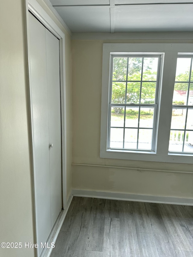 4735 Cedar Ln SW, Ocean Isle Beach, NC 28469 - unfurnished bedroom featuring light wood-style flooring and a closet