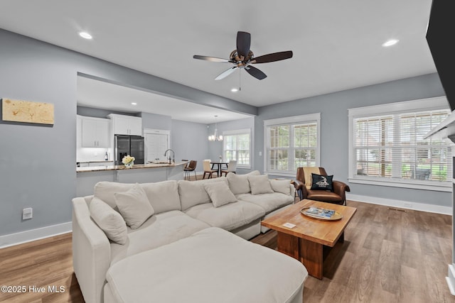 1 Miles Ct, Pinehurst, NC 28374 - living area with ceiling fan, wood finished floors, recessed lighting, and a chandelier