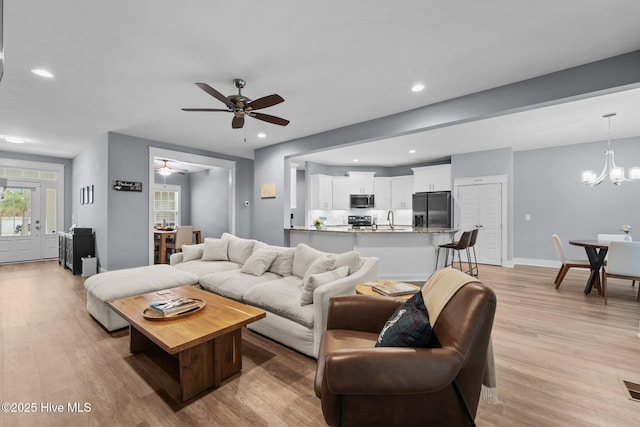 1 Miles Ct, Pinehurst, NC 28374 - living room with light wood-style flooring, ceiling fan, recessed lighting, and a chandelier