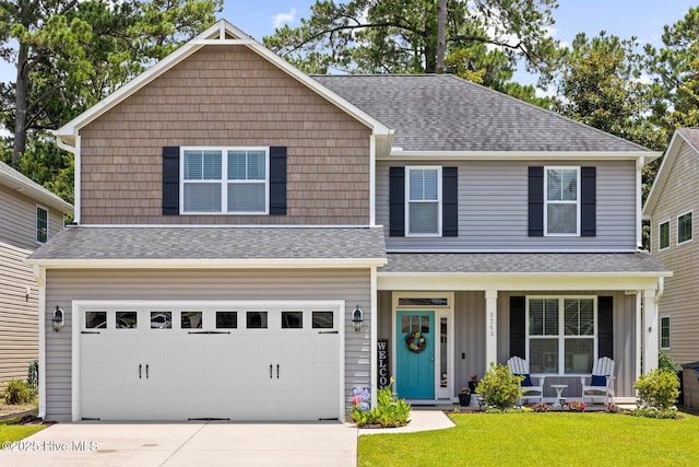 3243 Kellerton Pl, Wilmington, NC 28409 - view of front of house with covered porch, a front lawn, concrete driveway, and a shingled roof
