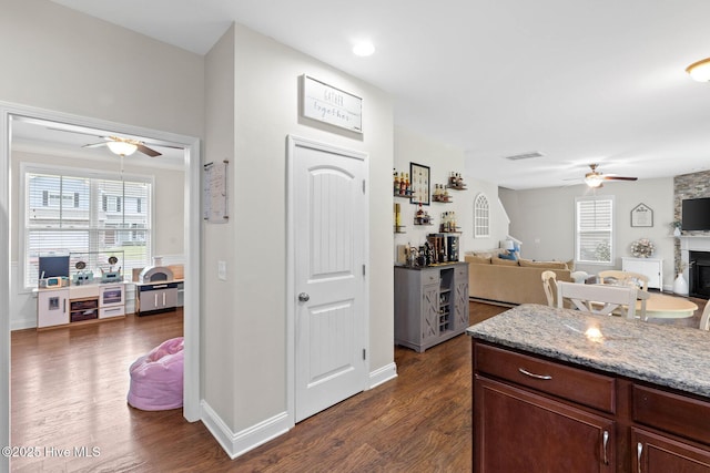 3243 Kellerton Pl, Wilmington, NC 28409 - kitchen featuring a ceiling fan, open floor plan, and dark wood-style flooring